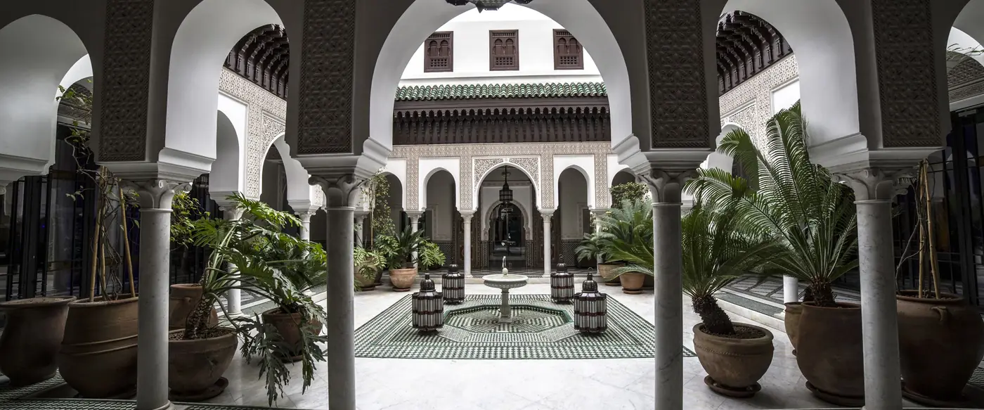 Arches and zellige around a palace courtyard